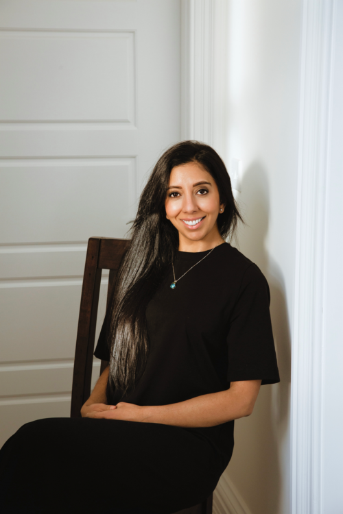 Leena Parmar sat confidently in a chair