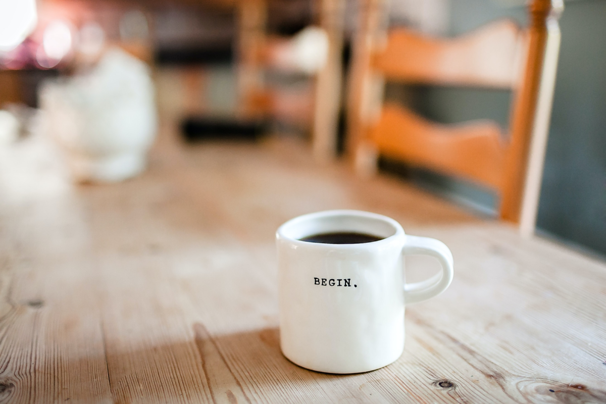A mug full of coffee on a table