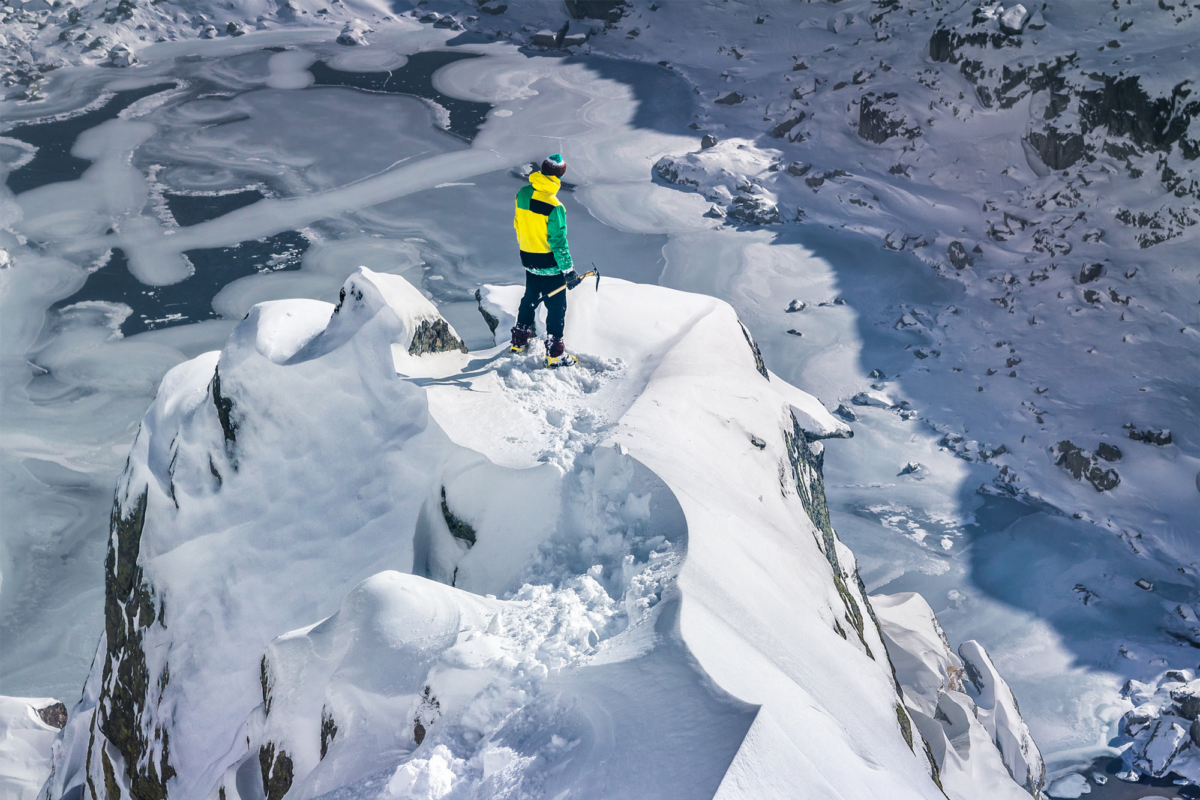 A person stood atop of a mountain