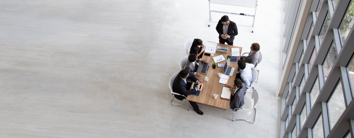 A group of business people sat at a table