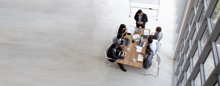 A group of business people sat at a table