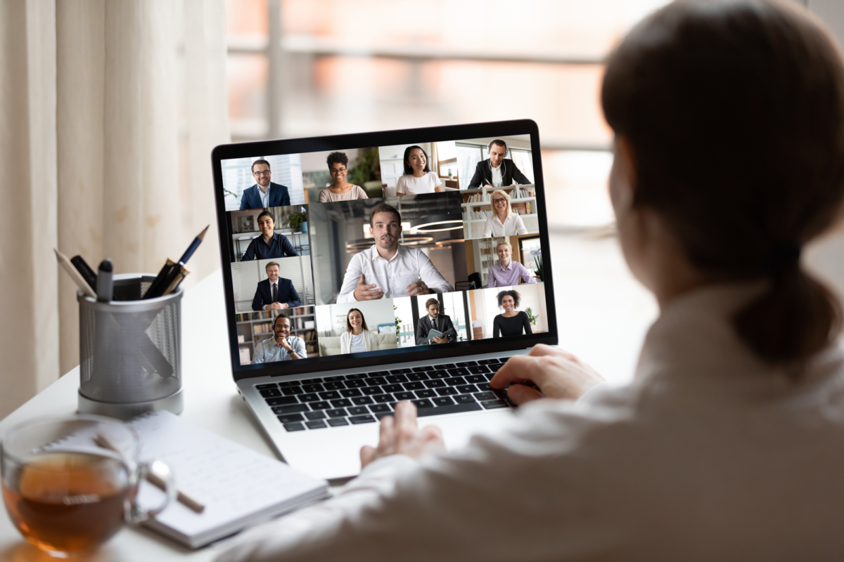 A woman sat on her laptop in a virtual meeting