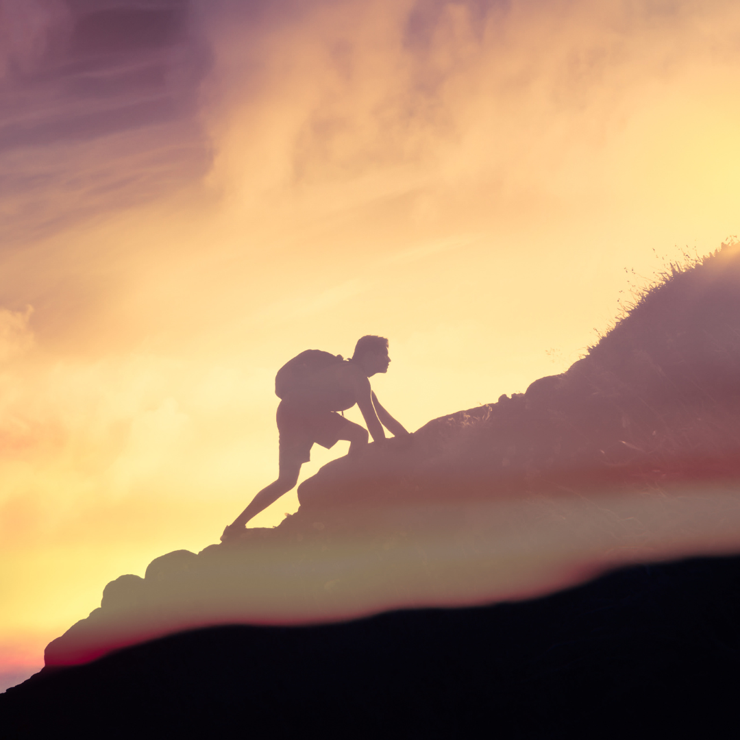 A man climbing a mountain