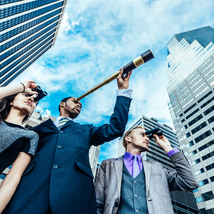 A trio of business people looking through binoculars in the city
