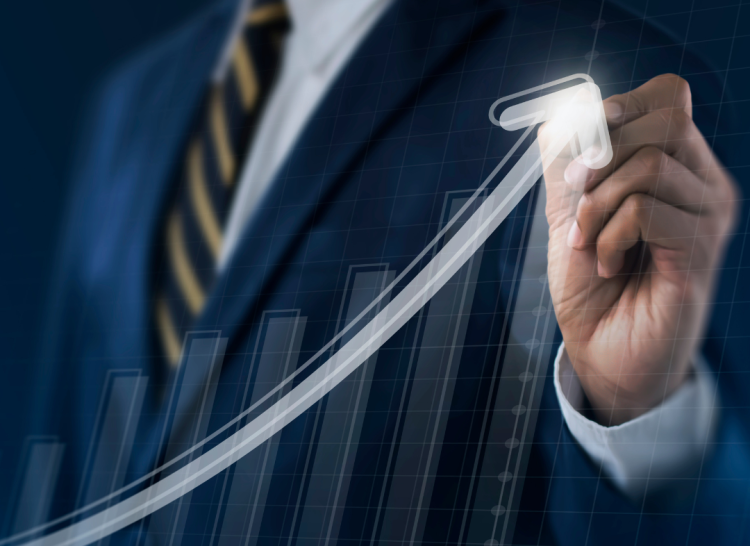 A graphic of a chat with an uptick arrow drawn by a man in a blue suit