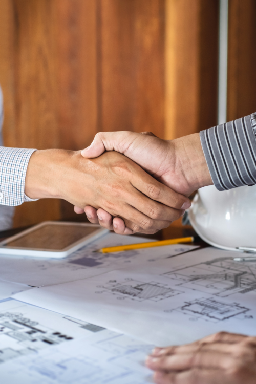 A handshake between 2 sales professionals