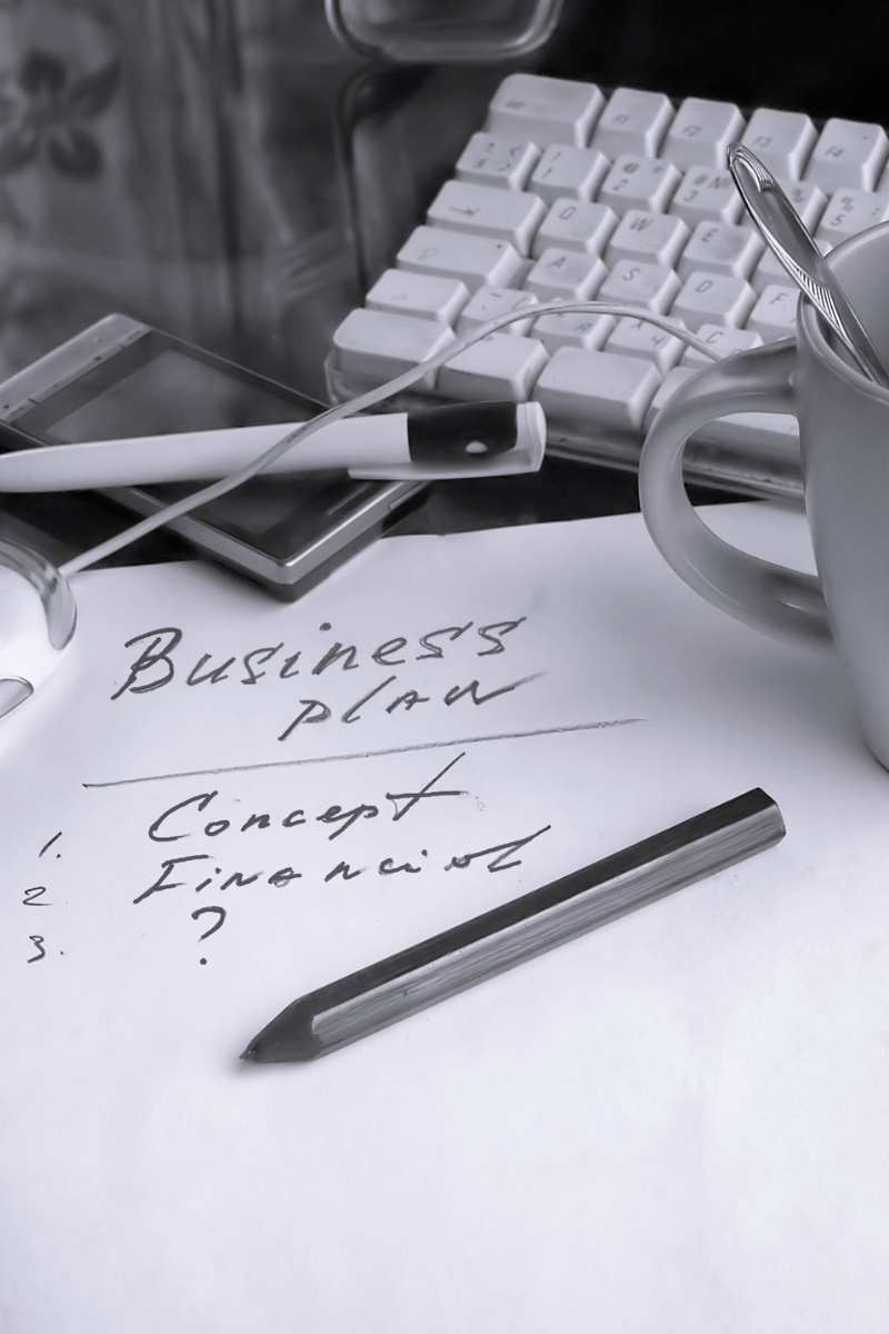 A piece of paper with handwritten business plan on it